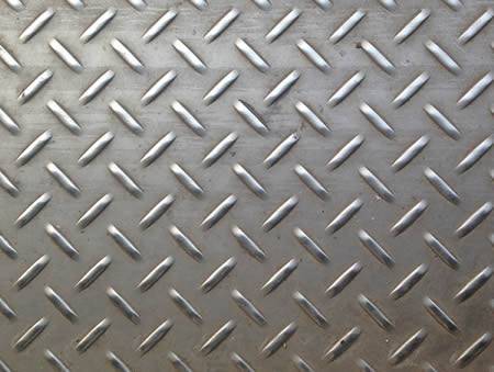 A piece of stainless steel checker plate with raised short willow leaf projections.