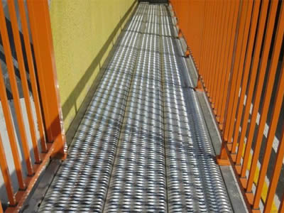Diamond-Strut plank grating as industrial walkway.